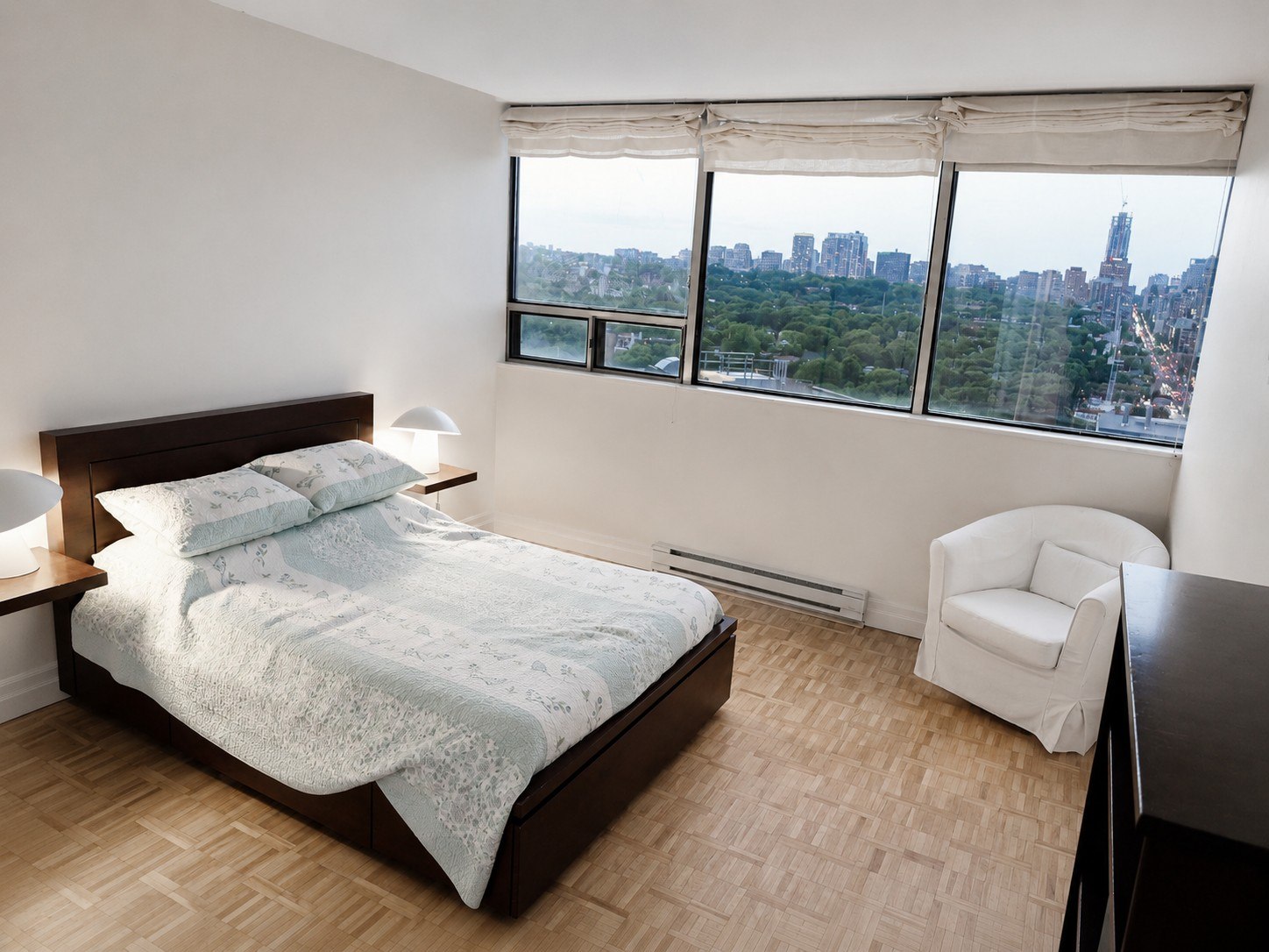 Bedroom with floor-to-ceiling city view