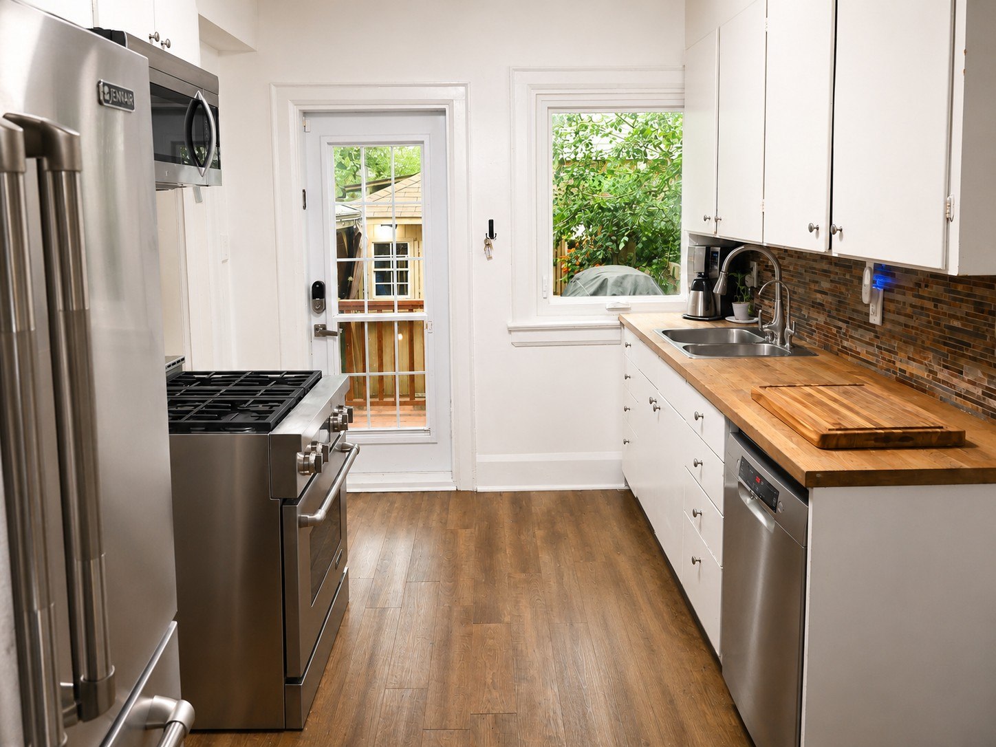 Galley kitchen with stainless steel appliances