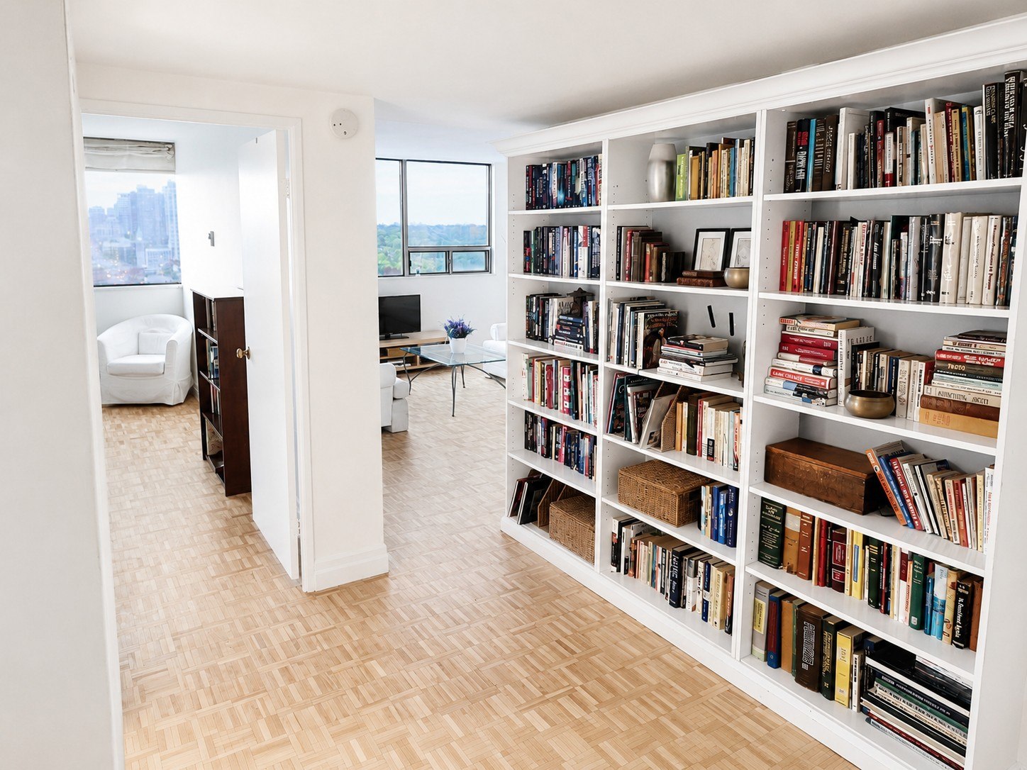 Hallway with floor-to-ceiling bookshelf